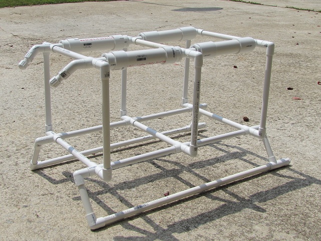 The 1/1/2' 1/2" PVC frame, the four larger pieces on top are for stability, the little angles on top are where I'm going to mount lights and the things on the bottom are skids.