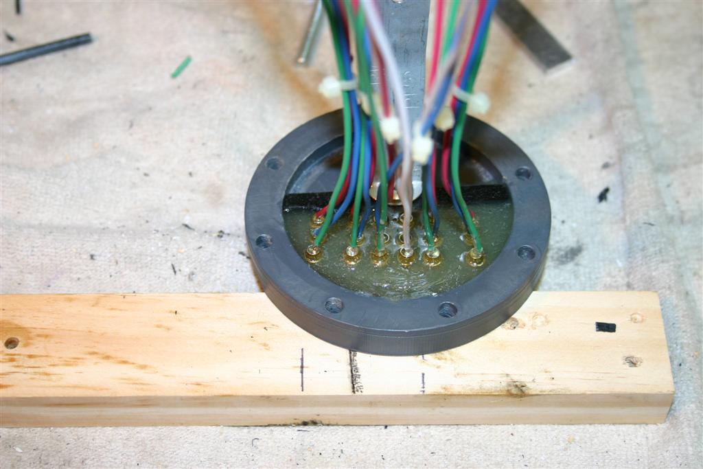 The rear bulkhead with made with a .25" well in the middle to allow me to pot the female bullet connectors with slow setting epoxy. I cleaned the PVC with PVC pipe cleaner before the connectors were potted. This allowed the epoxy to bond to the PVC.